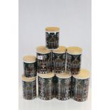 Collection of nine Portmierion storage jars in Magic City pattern, all with wooden lids