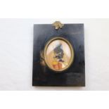 A silhouette of a military man, heightened in watercolour in rectangular frame, acorn finial,