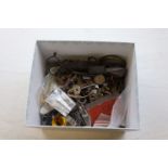 A box of mixed items to include clock keys, clock parts, candle wick cutters etc