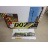 Four ex shop display signs featuring Hornby x 2, Britains Space and Corgi James Bond 007 ranging