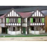 Large Triang double fronted dolls house approx 47 inches in length with small quantity of