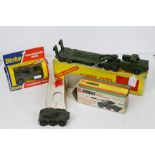 Three boxed military diecast models to include Dinky 660 Tank Transporter, Dinky 612 Commando Jeep