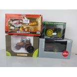 Four boxed farming vehicles and accessories to include Britains 9574 Front End Loader (one hay
