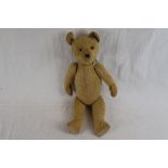 Vintage straw filled Teddy Bear with inactive growler & moving limbs and head approximately 16