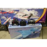 Boxed Super Cub Hobby Zone r/c plane, a boxed FlyFly Mirage 2000 and a boxed Twister r/c Hawk