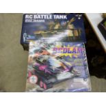 Two boxed RC vehicles to include Radio Shack Bedlam Telecommande and 1:24 Radio Controlled Battle