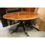 19th century Oval Tilt Top Loo / Centre Table raised on a turned column support and four reeded