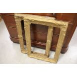 A pair of 19th century gilt leaf wood and gesso rococo swept picture frames