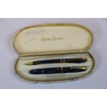 Cased ladies Conway Stewart pen set, comprising Dinkie 550 lever fill fountain pen with 14ct gold