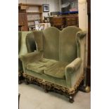 Carved Oak Framed & Green Upholstered Two Seater Sofa in the late 17th century Style, a high