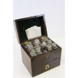 A 18th century mahogany apothecary box containing thirteen glass bottles with stoppers, the drawer