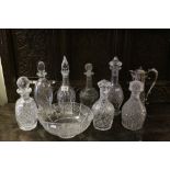 Collection of seven vintage cut glass Decanters, a Claret Jug with Silver plated mounts and a cut