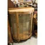 1930's Walnut Shaped Bow Fronted Glass Display Cabinet with Two Glass Shelves