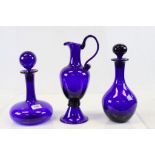 Three large boxed items of Bristol Blue Glass to include two Decanters and an Ewer