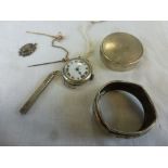 A circa 1920s/1930s circular silver wristwatch, a travelling white metal cased toothpick, a