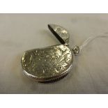 An Edwardian silver circular vesta case, engraved foliate decoration to front and reverse, blank