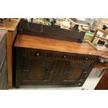 Mid 20th century Oak Jacobean Style Sideboard, the three drawers with thumbnail style carving over