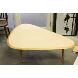 Contemporary Pebble Shaped Oak Coffee Table raised on three tapering legs