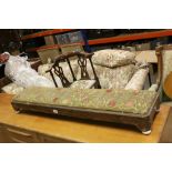 19th century Long Footstool with Woolwork Upholstered Seat and raised on four white ceramic feet,