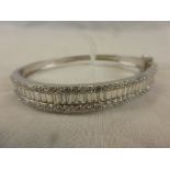 An impressive silver and CZ bangle