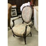 Victorian Oval Back Salon Elbow Chair, with Scroll Carved Arms and Legs raised on Castors