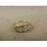 Silver ring with five graduated opals