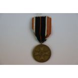 A WW2 German 1939 War Merit Cross Medal With Original Ribbon.