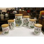 Six Portmierion storage jars in "Botanical Garden" pattern, with wooden lids