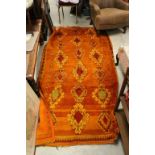 Vintage rug in red and orange