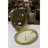 Two small bevelled Glass oval wall Mirrors with Gilt frames plus a small Swing Mirror