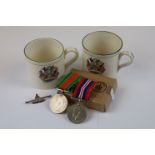 A Pair Of Full Size British WW2 Medals Contained In The Original Box Of Issue To Include The Defence