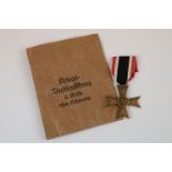 A WW2 German Third Reich War Merit Cross 2nd Class Medal With Original Ribbon And Issue Envelope.