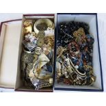 Two shoe boxes of assorted vintage costume jewellery to include necklaces, bangles, beads,