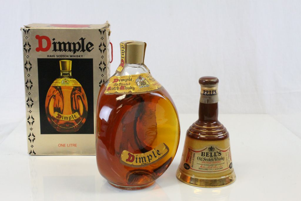 A boxed unopened bottle of Dimple Old Blended Scotch Whisky together with a bottle of Bells Old