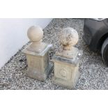 Two Reconstituted Stone Ball Finials stood on Square Bases