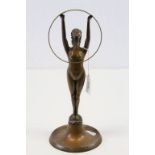 Art Deco bronze figure of a nude female with head tipped back and arms outstretched supporting a