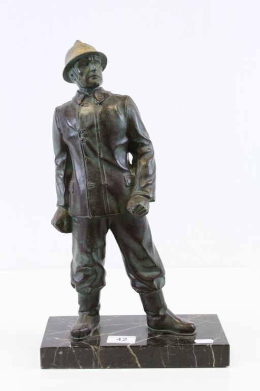 Bronzed figure of a French Fireman on a Marble base