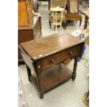 Oak Side Table with Drop Flaps to either end and Single Drawer, raised on castors