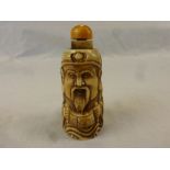 Bone snuff bottle in the form of a netsuke style carved man with scroll