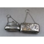 Two silver finger purses, one of rectangular form with cherub decoration, lined interior,