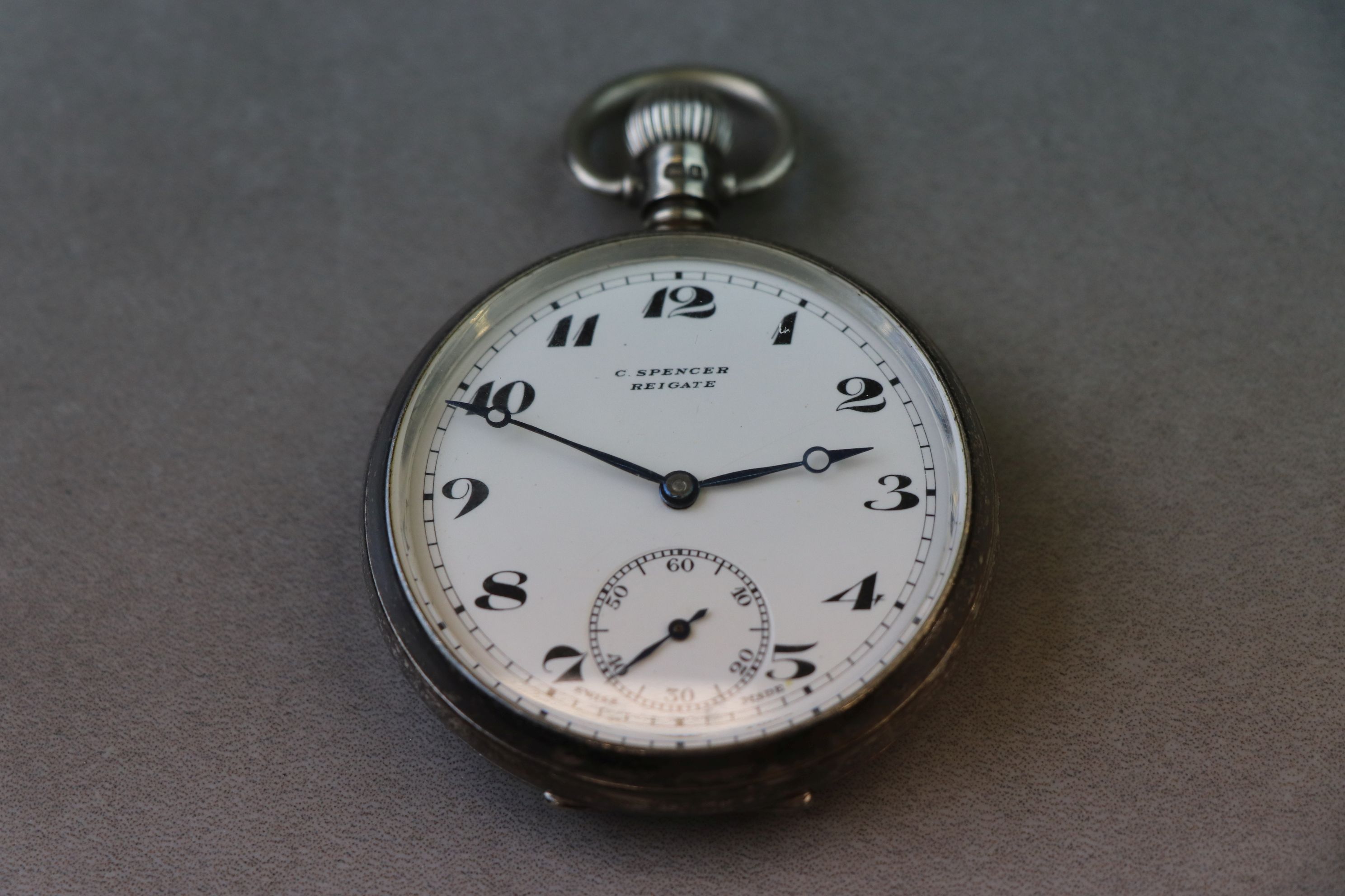 Silver open face top wind pocket watch, white enamel dial and subsidiary seconds dial, black