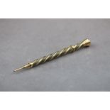 A woven cloth and yellow metal propelling pencil with spiral design outer case, initialled RC to