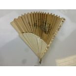 Early 20th century ivory fan with mother of pearl inlay and silk embroidered interior