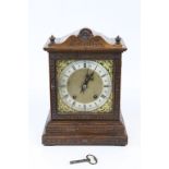 Late 19th century Oak Cased Mantle Clock, the Brass and Silvered Dial with Roman Numeral, with