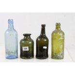 Four vintage Glass bottles to include Gin type