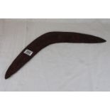Carved rustic boomerang, length approximately 52cm