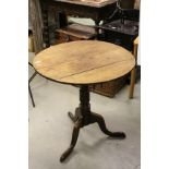 Georgian Oak Tilt Top Circular Table on turned and ringed pedestal base with tripod feet, approx