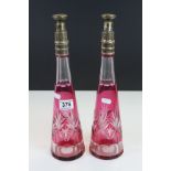 pair of cut glass conical Decanters with Ruby flash overlay and silver plated collar & caps