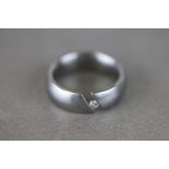Diamond titanium ring, the diamond weight 0.06 carat stated weight, ring size I½