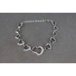Silver Bracelet set with CZ's with graduating hearts